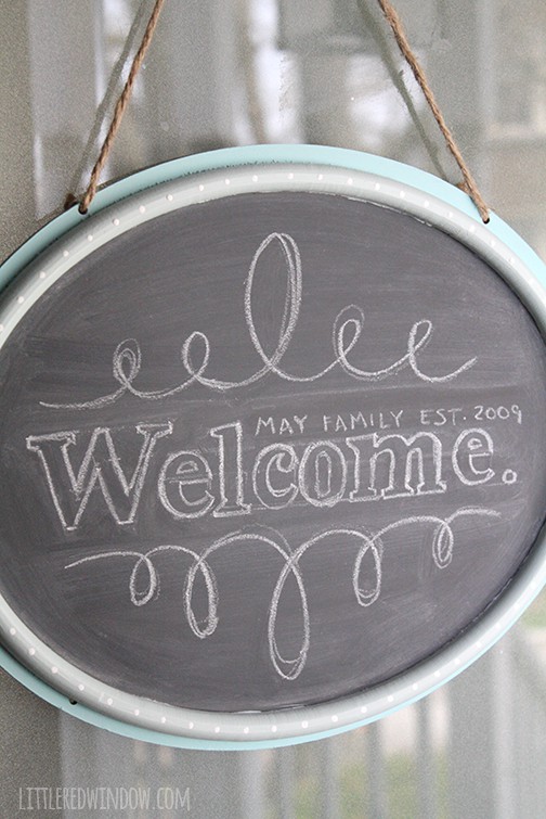 DIY Hanging Chalkboard Door Sign | littleredwindow.com | Personalize a plain door sign from the dollar section for your home!