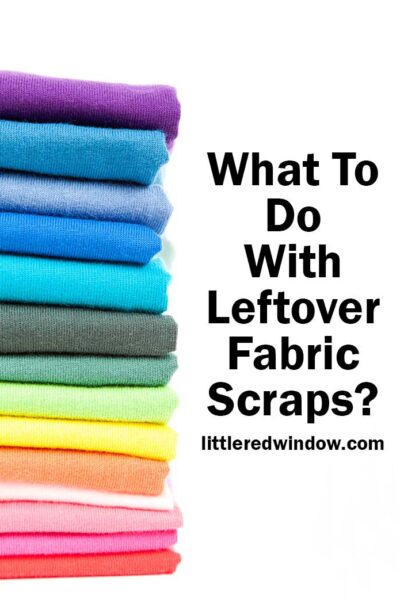 A stack of rainbow colored folded fabric stacked vertically on the left in front of a white background